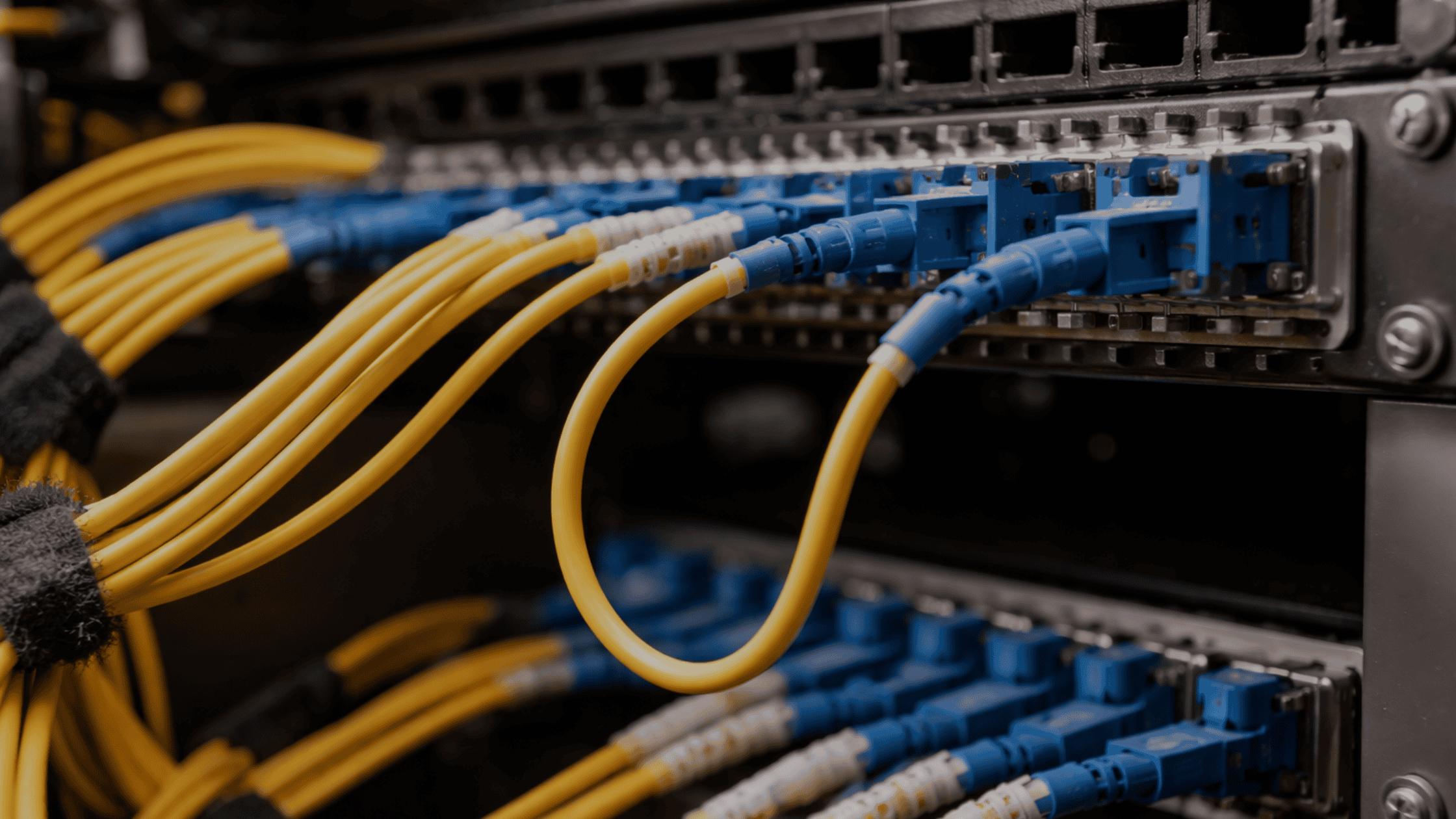 Fiber optic cable installation with improper bend radius causing signal loss in business network