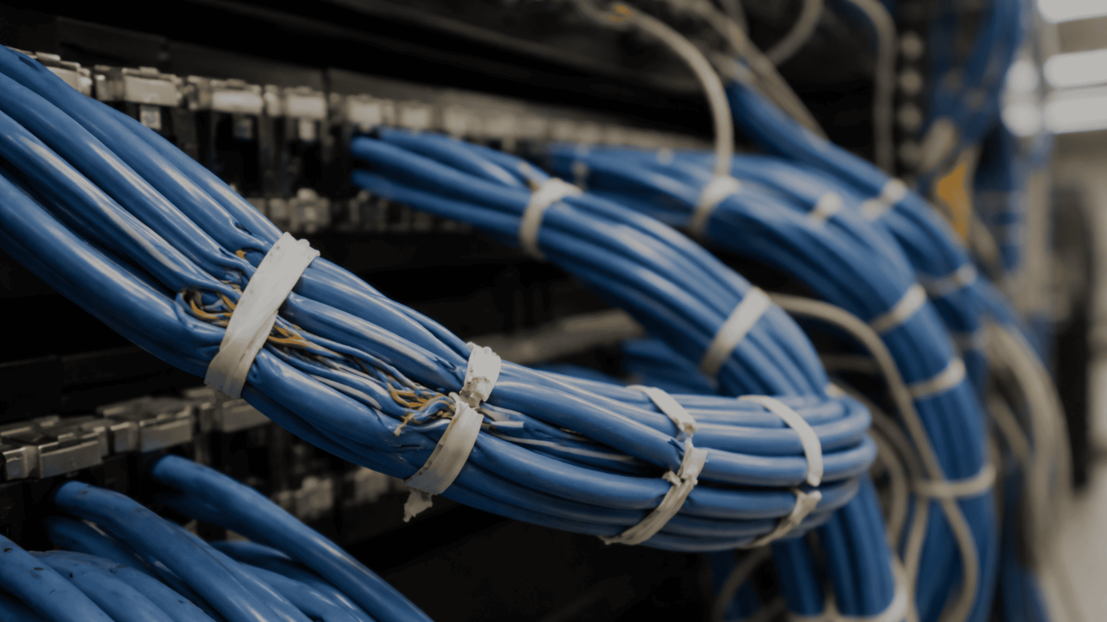 Overtightened cable ties damaging a structured cabling system in a business server room