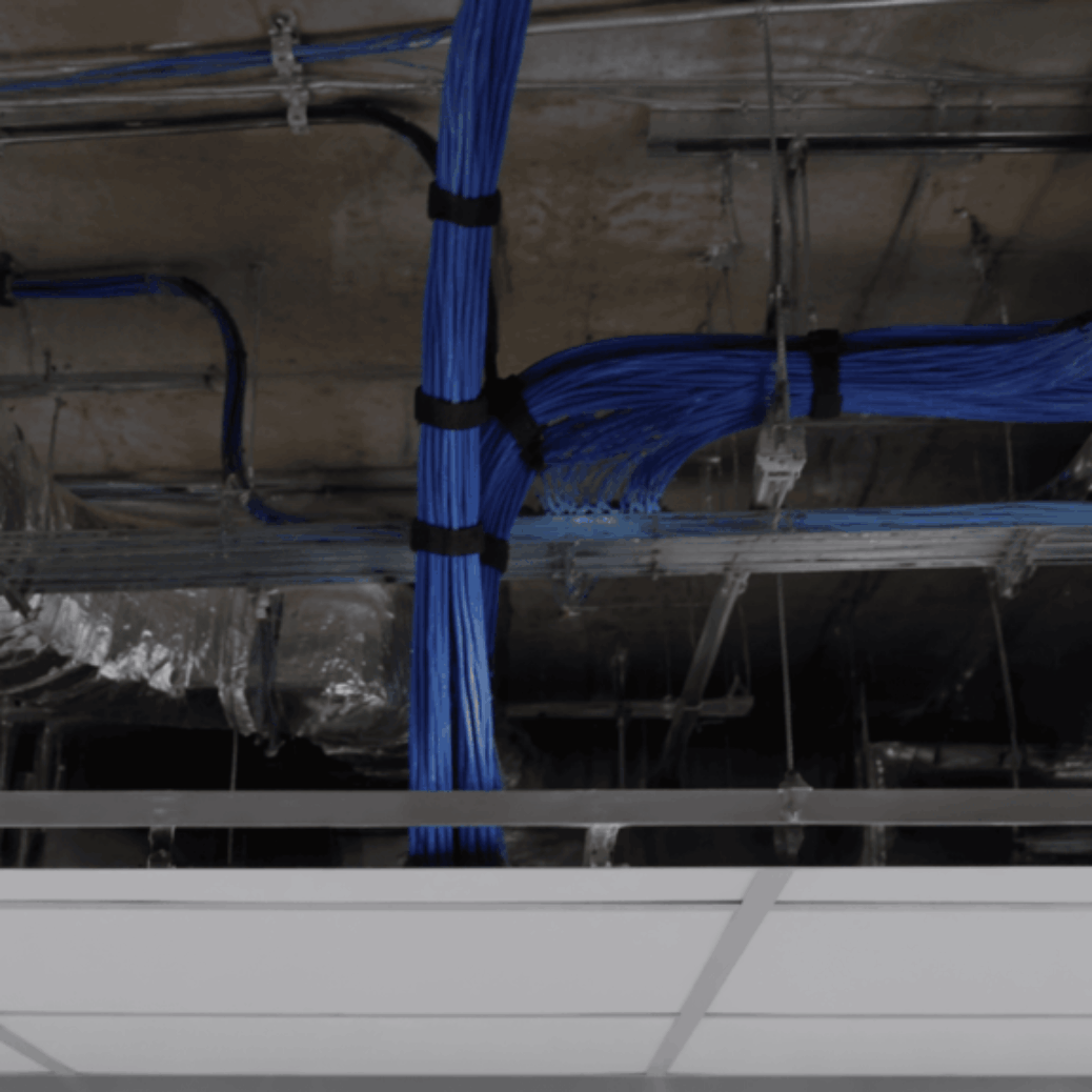 Plenum cabling installed above an office ceiling for code-compliant low voltage wiring